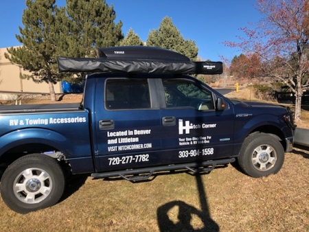 Rhino Rack Batwing Folded Up On Hitch Corner Truck